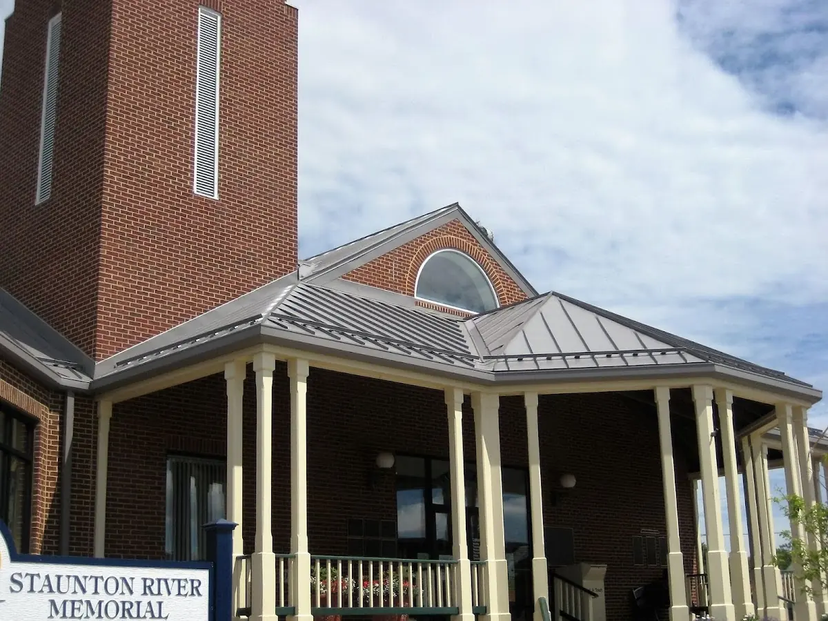 Skilled roofing craftsmen working on a residential roof in Selma